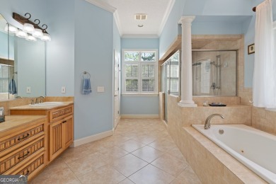 Nestled on a picturesque half-acre lot on the desirable Oak on Oak Grove Island Golf and Country Club in Georgia - for sale on GolfHomes.com, golf home, golf lot