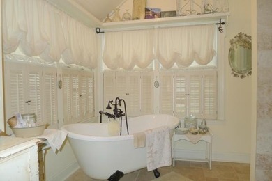 Stone Ranch cottage in coveted Golden Acres is pure magic on Drumm Farm Golf Course in Missouri - for sale on GolfHomes.com, golf home, golf lot