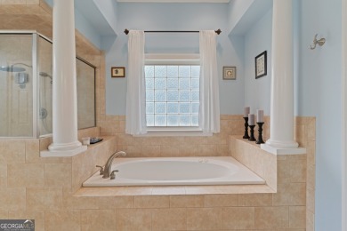 Nestled on a picturesque half-acre lot on the desirable Oak on Oak Grove Island Golf and Country Club in Georgia - for sale on GolfHomes.com, golf home, golf lot