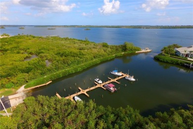 DISCOVER PELICAN POINTE: Your riverside paradise awaits! Enjoy on Pelican Pointe 9 Hole Course in Florida - for sale on GolfHomes.com, golf home, golf lot