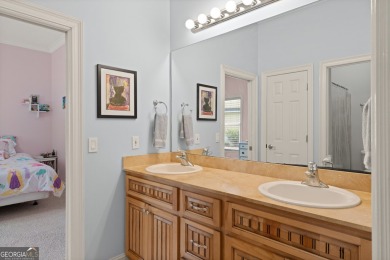 Nestled on a picturesque half-acre lot on the desirable Oak on Oak Grove Island Golf and Country Club in Georgia - for sale on GolfHomes.com, golf home, golf lot