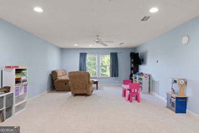 Nestled on a picturesque half-acre lot on the desirable Oak on Oak Grove Island Golf and Country Club in Georgia - for sale on GolfHomes.com, golf home, golf lot