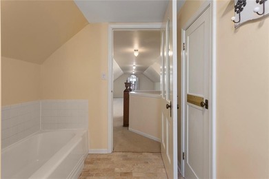 Stone Ranch cottage in coveted Golden Acres is pure magic on Drumm Farm Golf Course in Missouri - for sale on GolfHomes.com, golf home, golf lot