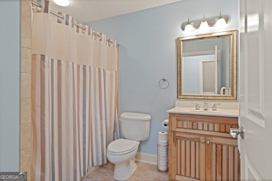 Nestled on a picturesque half-acre lot on the desirable Oak on Oak Grove Island Golf and Country Club in Georgia - for sale on GolfHomes.com, golf home, golf lot
