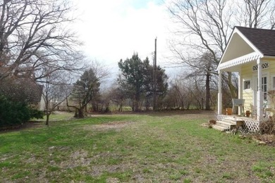 Stone Ranch cottage in coveted Golden Acres is pure magic on Drumm Farm Golf Course in Missouri - for sale on GolfHomes.com, golf home, golf lot