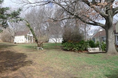 Stone Ranch cottage in coveted Golden Acres is pure magic on Drumm Farm Golf Course in Missouri - for sale on GolfHomes.com, golf home, golf lot