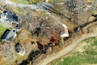 Stone Ranch cottage in coveted Golden Acres is pure magic on Drumm Farm Golf Course in Missouri - for sale on GolfHomes.com, golf home, golf lot