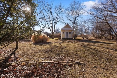 Stone Ranch cottage in coveted Golden Acres is pure magic on Drumm Farm Golf Course in Missouri - for sale on GolfHomes.com, golf home, golf lot