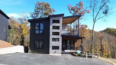 Stunning brand-new 4-bedroom, 5-bath luxury cabin featuring both on Sevierville Golf Club in Tennessee - for sale on GolfHomes.com, golf home, golf lot