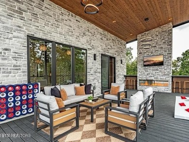 Stunning brand-new 4-bedroom, 5-bath luxury cabin featuring both on Sevierville Golf Club in Tennessee - for sale on GolfHomes.com, golf home, golf lot