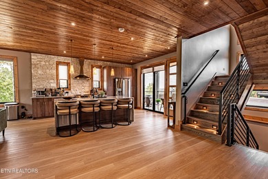 Stunning brand-new 4-bedroom, 5-bath luxury cabin featuring both on Sevierville Golf Club in Tennessee - for sale on GolfHomes.com, golf home, golf lot