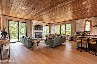 Stunning brand-new 4-bedroom, 5-bath luxury cabin featuring both on Sevierville Golf Club in Tennessee - for sale on GolfHomes.com, golf home, golf lot