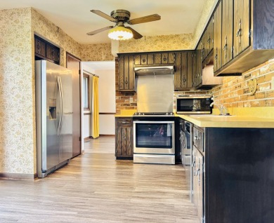 Move right in to this beautiful brick and spacious 4-bedroom on Lakes of the Four Seasons Country Club in Indiana - for sale on GolfHomes.com, golf home, golf lot