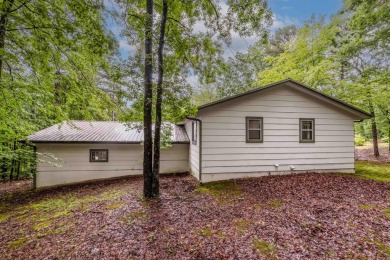 Nestled at the end of a peaceful dead-end street, this inviting on Mountain Ranch Golf Club in Arkansas - for sale on GolfHomes.com, golf home, golf lot