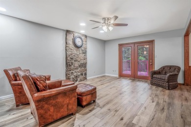 Nestled at the end of a peaceful dead-end street, this inviting on Mountain Ranch Golf Club in Arkansas - for sale on GolfHomes.com, golf home, golf lot