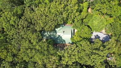 Discover peaceful East Texas living in this spacious 3,052 sq ft on Holly Lake Ranch Golf Club in Texas - for sale on GolfHomes.com, golf home, golf lot