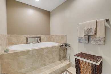 Beautifully turnkey furnished, this spacious 2-bedroom, 2-bath on Eagle Creek Golf and Country Club in Florida - for sale on GolfHomes.com, golf home, golf lot