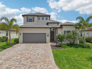 This expansive 2022-built Catalina model in Lakewood National on Lakewood National Golf Club in Florida - for sale on GolfHomes.com, golf home, golf lot