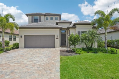 This expansive 2022-built Catalina model in Lakewood National on Lakewood National Golf Club in Florida - for sale on GolfHomes.com, golf home, golf lot