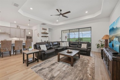 This expansive 2022-built Catalina model in Lakewood National on Lakewood National Golf Club in Florida - for sale on GolfHomes.com, golf home, golf lot