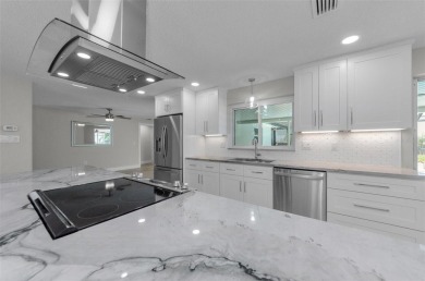 Welcome to this stunning renovated 4-bedroom, 3-bathroom pool on The Dunedin Country Club in Florida - for sale on GolfHomes.com, golf home, golf lot
