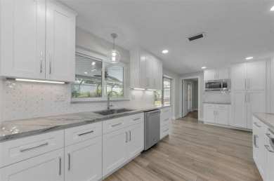 Welcome to this stunning renovated 4-bedroom, 3-bathroom pool on The Dunedin Country Club in Florida - for sale on GolfHomes.com, golf home, golf lot