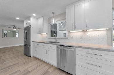 Welcome to this stunning renovated 4-bedroom, 3-bathroom pool on The Dunedin Country Club in Florida - for sale on GolfHomes.com, golf home, golf lot