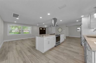 Welcome to this stunning renovated 4-bedroom, 3-bathroom pool on The Dunedin Country Club in Florida - for sale on GolfHomes.com, golf home, golf lot