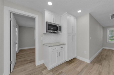 Welcome to this stunning renovated 4-bedroom, 3-bathroom pool on The Dunedin Country Club in Florida - for sale on GolfHomes.com, golf home, golf lot