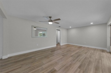 Welcome to this stunning renovated 4-bedroom, 3-bathroom pool on The Dunedin Country Club in Florida - for sale on GolfHomes.com, golf home, golf lot