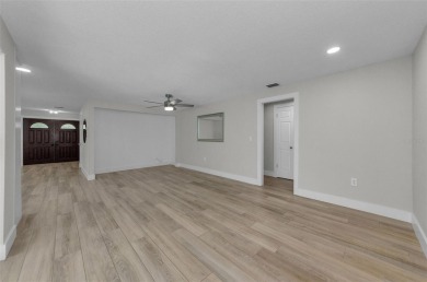 Welcome to this stunning renovated 4-bedroom, 3-bathroom pool on The Dunedin Country Club in Florida - for sale on GolfHomes.com, golf home, golf lot