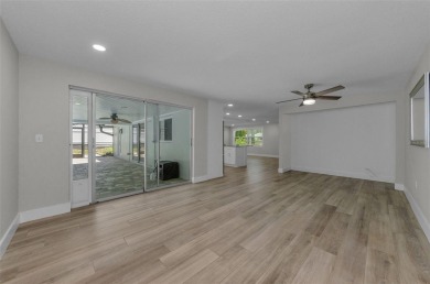 Welcome to this stunning renovated 4-bedroom, 3-bathroom pool on The Dunedin Country Club in Florida - for sale on GolfHomes.com, golf home, golf lot