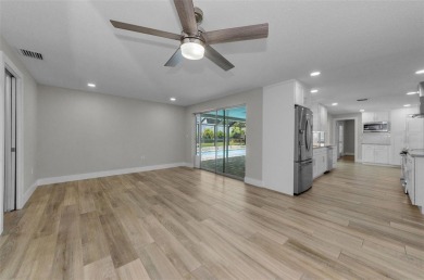 Welcome to this stunning renovated 4-bedroom, 3-bathroom pool on The Dunedin Country Club in Florida - for sale on GolfHomes.com, golf home, golf lot