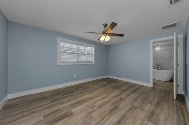 Welcome to this stunning renovated 4-bedroom, 3-bathroom pool on The Dunedin Country Club in Florida - for sale on GolfHomes.com, golf home, golf lot