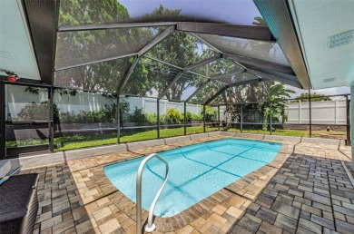 Welcome to this stunning renovated 4-bedroom, 3-bathroom pool on The Dunedin Country Club in Florida - for sale on GolfHomes.com, golf home, golf lot