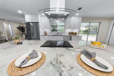 Welcome to this stunning renovated 4-bedroom, 3-bathroom pool on The Dunedin Country Club in Florida - for sale on GolfHomes.com, golf home, golf lot