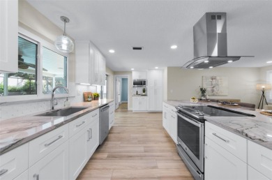 Welcome to this stunning renovated 4-bedroom, 3-bathroom pool on The Dunedin Country Club in Florida - for sale on GolfHomes.com, golf home, golf lot