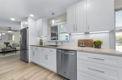 Welcome to this stunning renovated 4-bedroom, 3-bathroom pool on The Dunedin Country Club in Florida - for sale on GolfHomes.com, golf home, golf lot