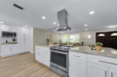 Welcome to this stunning renovated 4-bedroom, 3-bathroom pool on The Dunedin Country Club in Florida - for sale on GolfHomes.com, golf home, golf lot