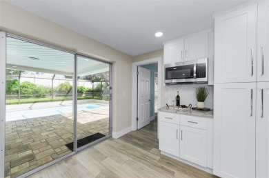Welcome to this stunning renovated 4-bedroom, 3-bathroom pool on The Dunedin Country Club in Florida - for sale on GolfHomes.com, golf home, golf lot
