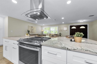 Welcome to this stunning renovated 4-bedroom, 3-bathroom pool on The Dunedin Country Club in Florida - for sale on GolfHomes.com, golf home, golf lot