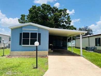 This home is in a 55 plus community with a monthly lot rent of on Crystal Lake Club in Florida - for sale on GolfHomes.com, golf home, golf lot