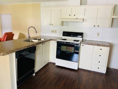 This home is in a 55 plus community with a monthly lot rent of on Crystal Lake Club in Florida - for sale on GolfHomes.com, golf home, golf lot