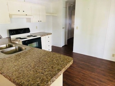 This home is in a 55 plus community with a monthly lot rent of on Crystal Lake Club in Florida - for sale on GolfHomes.com, golf home, golf lot