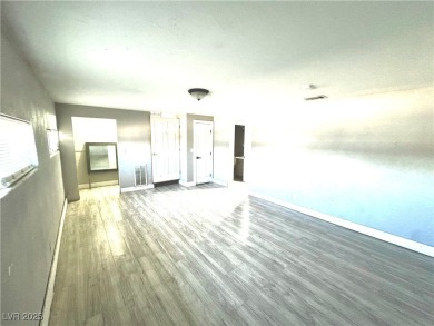The home has undergone recent renovations, featuring updated on Desert Rose Golf Course in Nevada - for sale on GolfHomes.com, golf home, golf lot