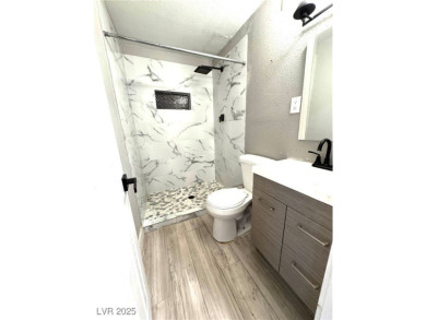 The home has undergone recent renovations, featuring updated on Desert Rose Golf Course in Nevada - for sale on GolfHomes.com, golf home, golf lot