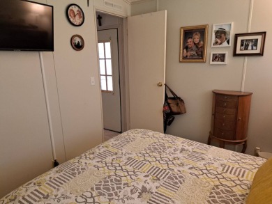 Located in a very active 55+ community close to shopping on Golden Lakes Golf Course in Florida - for sale on GolfHomes.com, golf home, golf lot