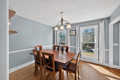 Nestled in the desirable Houndslake neighborhood, this inviting on Houndslake Country Club in South Carolina - for sale on GolfHomes.com, golf home, golf lot