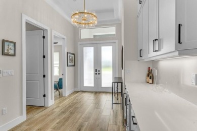 Stunning 5 bedroom, 3.5 bath Tavvo Signature home in the on Bent Pine Golf Club in Florida - for sale on GolfHomes.com, golf home, golf lot