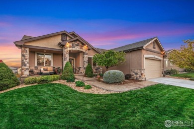 Tranquil lake views enhance the sense of calmness as you enter on Highland Meadows Golf Course in Colorado - for sale on GolfHomes.com, golf home, golf lot